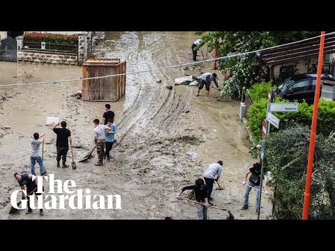 Drone footage shows residents clearing up mud in flood-hit Italy