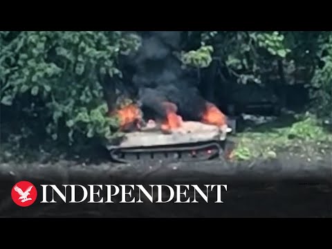 Russian soldiers flee after tank struck by Ukrainian drone