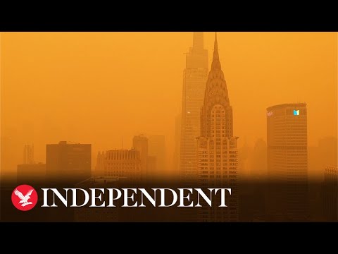 Mesmerising drone footage shows New York skyline blanketed in orange haze