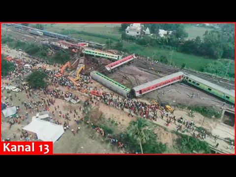 Drone footage shows stretch of derailed train carriages, crowds at India crash site