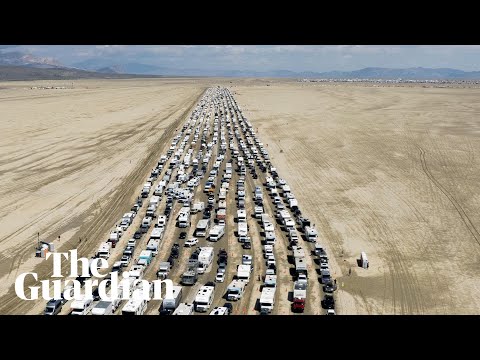 Drone video shows vehicles leaving Burning Man festival after days stranded in thick mud