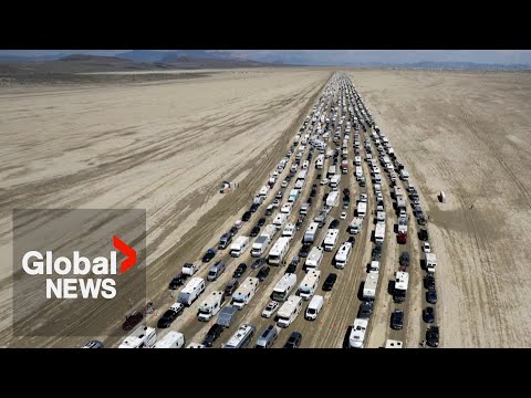 Burning Man exodus: Drone video shows thousands of vehicles trying to leave muddy desert festival